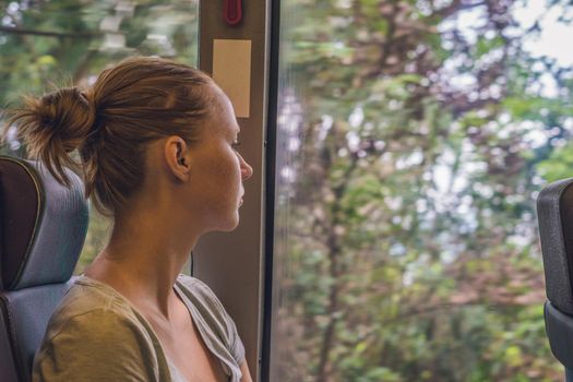 beautiful young woman taking bus to work.