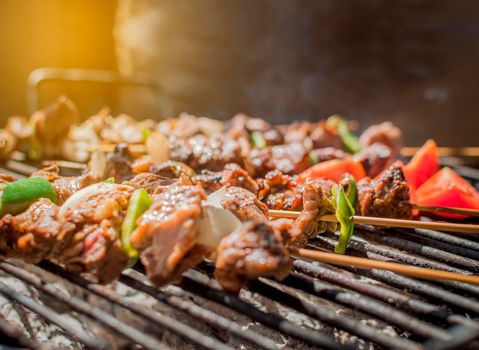 Roast beef skewers on a grill, Roast beef skewers grilling on a grill, Roast beef concept