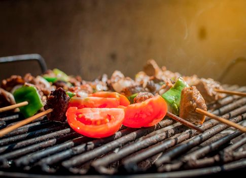 Roast beef skewers on a grill, Roast beef skewers grilling on a grill, Roast beef concept