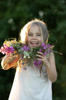 beautiful little girl in a wreath. High quality photo