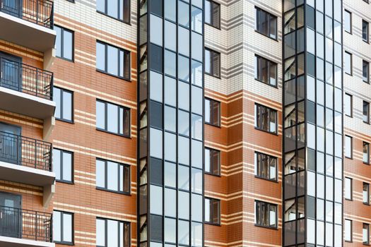 modern multi-family housing, residential building facade with aluminum windows.