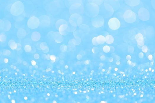 sparkles of Blue glitter abstract background. Copy space.