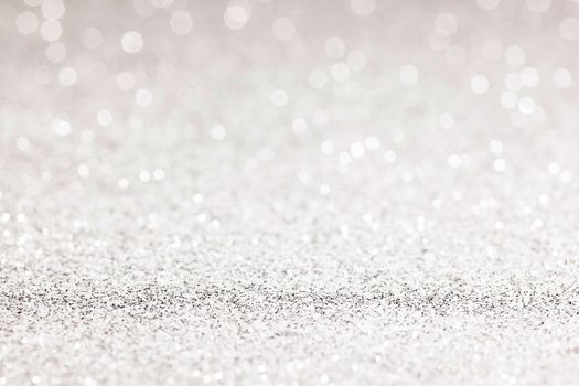 sparkles of Silver glitter abstract background. Copy space.