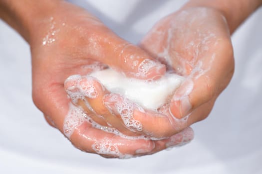 Closeup of man washing hands with soap. High quality photo