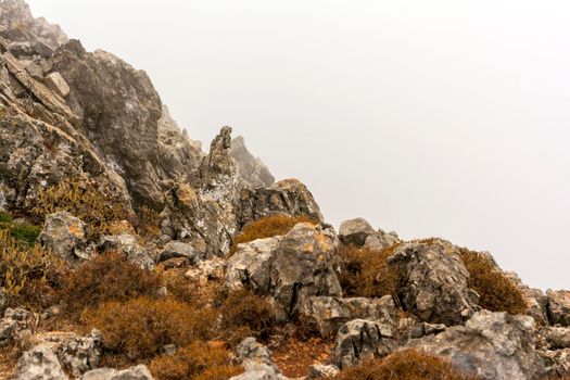 Fog over high mountain peak, Kythira, Greece.