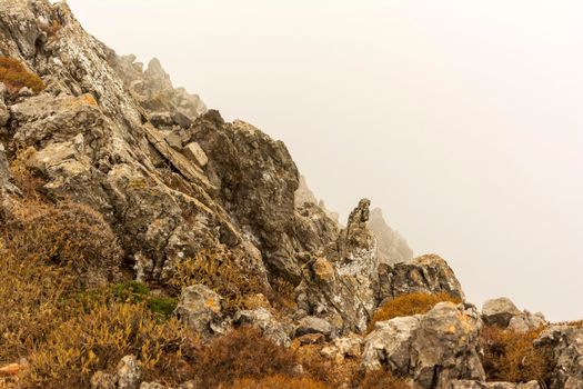 Fog over high mountain peak, Kythira, Greece.