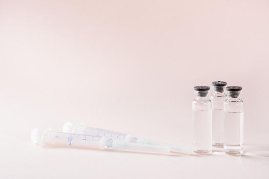 Vaccination and Immunization. Vaccine vials and clean syringes