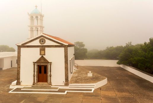 View of the famous old monastery of Agia Elesa in fog. Kythira island in Greece.