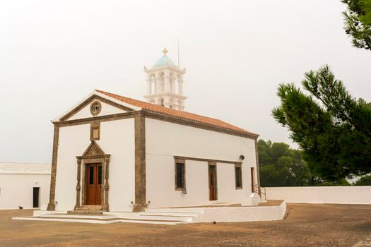 View of the famous old monastery of Agia Elesa in fog. Kythira island in Greece.