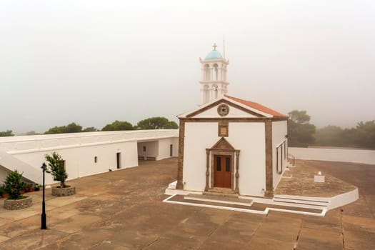 View of the famous old monastery of Agia Elesa in fog. Kythira island in Greece.