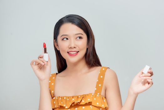 beauty woman applying lipstick on lips 