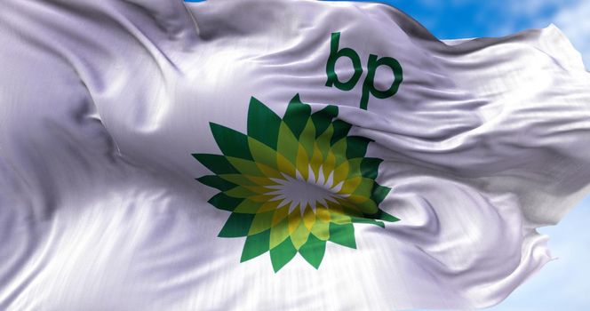 London, UK, August 2021: White flag with the British Petroleum logo waving in the wind. BP is a British multinational oil and gas company headquartered in London, England. Illustrative editorial.