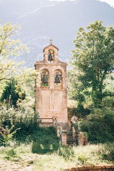 Bell tower of the Church of the Nativity of the Virgin in Prcanj. High quality photo