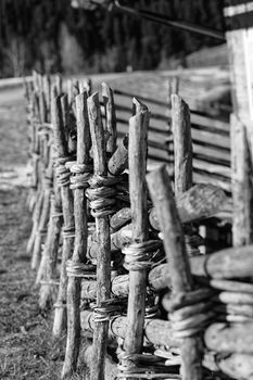 An old wooden fence on an alpine pasture.