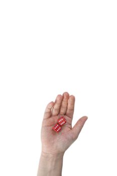 Female hand holds red gaming dice on white background. Double six Concept with copy space for games, game board, role playing game, risk, chance, good luck or gambling. Toned image top view. Close-up. space for text