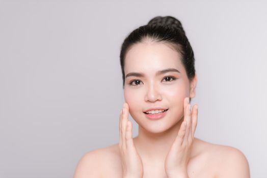 Beauty Portrait. Beautiful Spa Woman Touching her Face