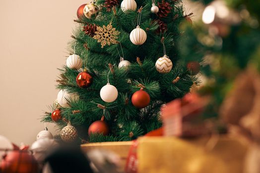 Decorating Christmas tree on bright background