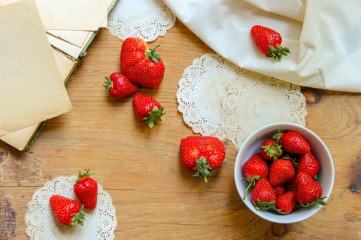 Harvest ripe, juicy strawberries close-up for design. Healthy dessert. Healthy diet. Rustic concept on a natural background. Summer background. Wooden table, table.