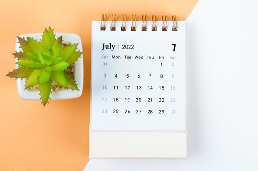 The July 2022 desk calendar with tree pot.