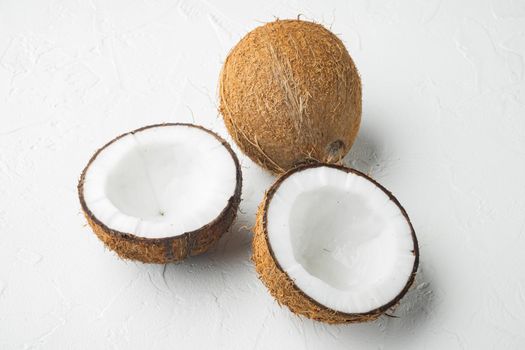 Coconut with half set, on white stone table background