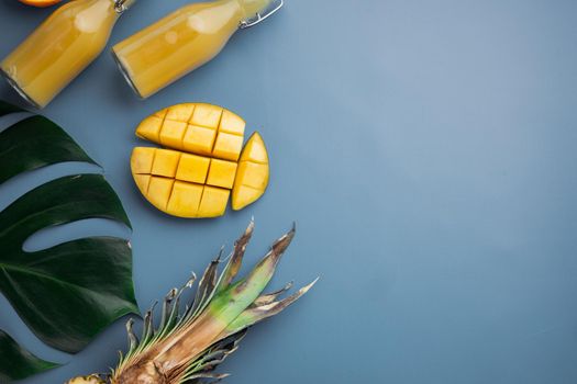Mix of different fruits set, on blue textured summer background, top view flat lay, with copy space for text