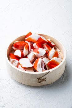 Fresh Crab meat surimi with blue swimming crab set, on wooden tray, on white background