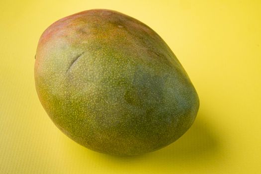 Ripe mango fruit set, on yellow textured summer background