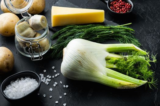 Artichoke with fennel, potato and parmesan ingredient, on black textured background