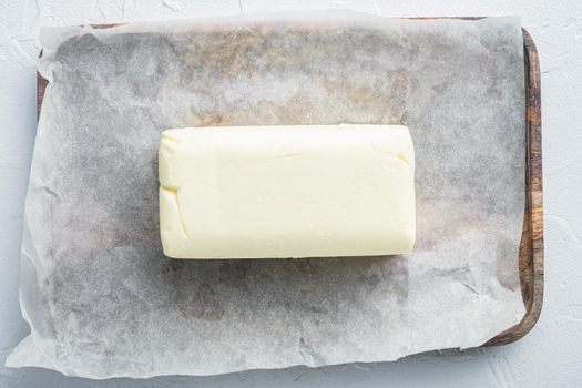 Dairy fresh butter, on white background, top view flat lay