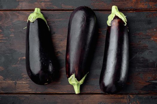 Eggplant, aubergine organic ripe whole vegetables set, on old dark wooden table background, top view flat lay