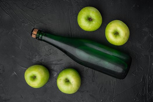 Healthy organic food. Apple cider vinegar set, on black dark stone table background, top view flat lay