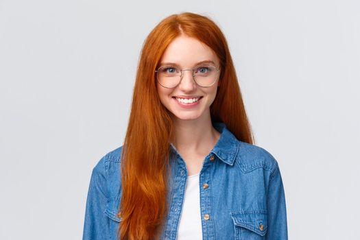Education, youth and courses concept. Close-up cheerful charismatic redhead teenage girl, college student in glasses, smiling and looking determined, starting new school year, white background.