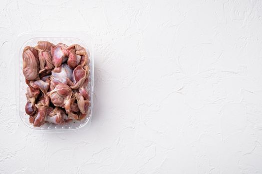 Chicken stomach container set, on white stone table background, top view flat lay, with copy space for text