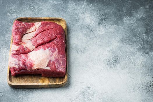 Brisket flat cut, raw beef brisket meat set, on gray stone background, with copy space for text