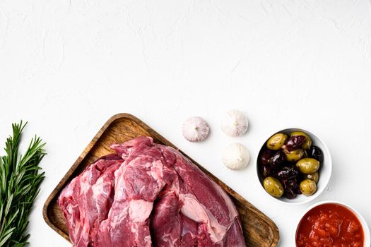 Lamb meat fresh raw set, with ingredients and herbs, on white stone table background, top view flat lay, with copy space for text