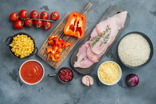 Mexican food ingredients Chicken Enchilada, Rice Casserole, on gray background, top view flat lay