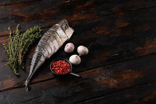 Japanese pickled mackerel set, on old dark wooden table background, top view flat lay, with copy space for text