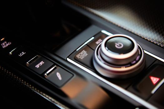 Luxury car tune control panel. Modern car interior.