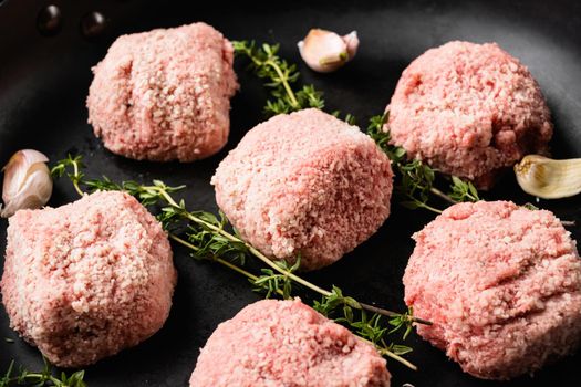 Home made raw meatballs set, on old dark rustic table background