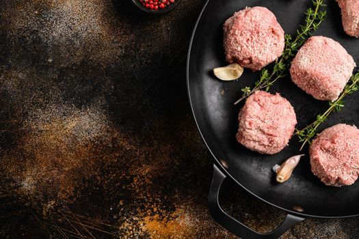 Organic minced meat meatball set, on old dark rustic table background, top view flat lay, with copy space for text