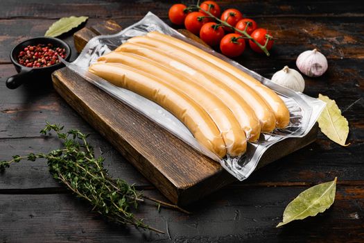 Sausage for hot dog set, on old dark wooden table background
