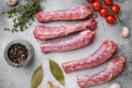 Raw uncooked chicken gizzards set, on gray stone table background, top view flat lay