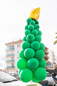 Extraordinary bizarre christmas tree in the street cafe.