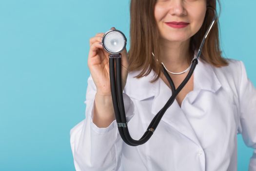 Young female doctor with stethoscope, close up.