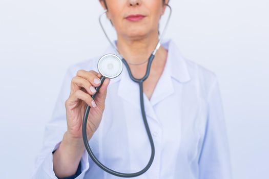 Young female doctor with stethoscope, close up.