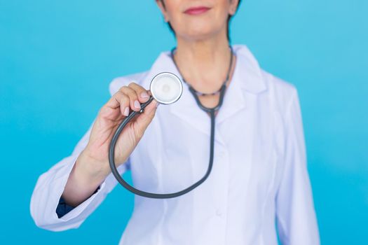 Young female doctor with stethoscope, close up.