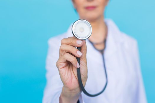 Young female doctor with stethoscope, close up.