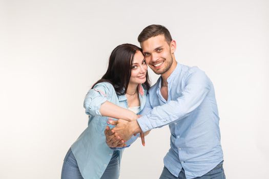 Relationship and love concept - Portrait of happy couple on white background.