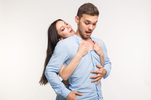 Relationship and love concept - Portrait of happy couple on white background.