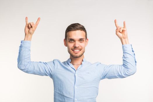 Cheerful young man posing on white background